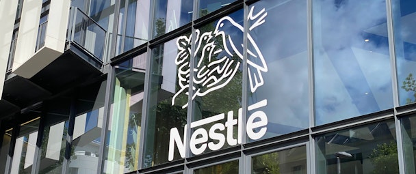 Nestlé logo on the facade of Nestlé France headquarters building near Paris, France Nestlé logo on the facade of Nestlé France headquarters building near Paris, France