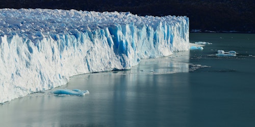 An ice floe in a body of water An ice floe in a body of water