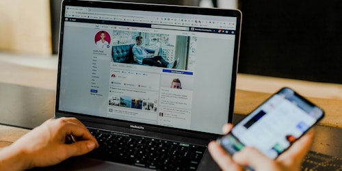 Facebook profile open on laptop Facebook profile open on laptop