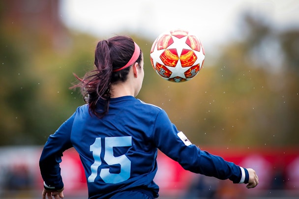 A woman playing football A woman playing football