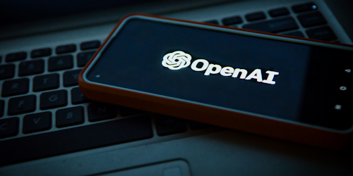 OpenAI logo on mobile screen OpenAI logo on mobile screen