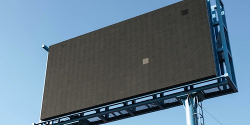 A blank digital billboard in front of a blue sky A blank digital billboard in front of a blue sky