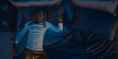 Lil Wayne lying on a bed Lil Wayne lying on a bed
