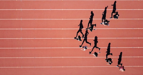 Runners on a track, in an arrow formation Runners on a track, in an arrow formation