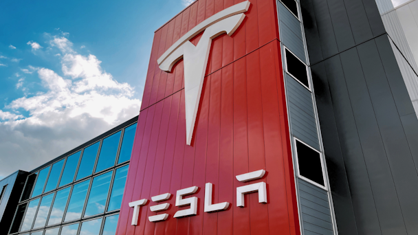 Tesla signage on the outside of a factory Tesla signage on the outside of a factory