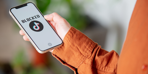 screen with the tiktok logo next to the words "Block" screen with the tiktok logo next to the words "Block"