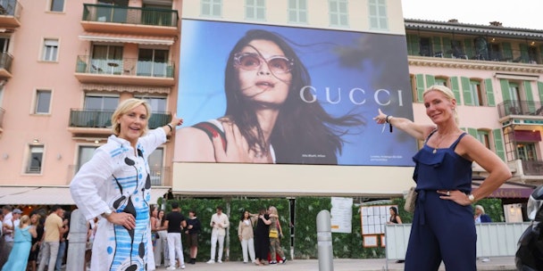 Two women point to an OOH ad at Cannes Lions Festival of Creativity Two women point to an OOH ad at Cannes Lions Festival of Creativity