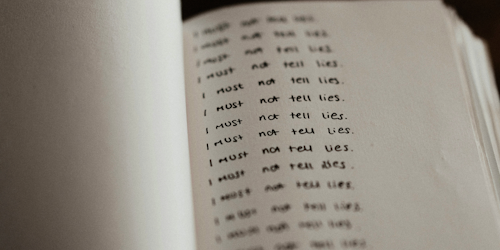 Someone writing I must not lie over and over Someone writing I must not lie over and over